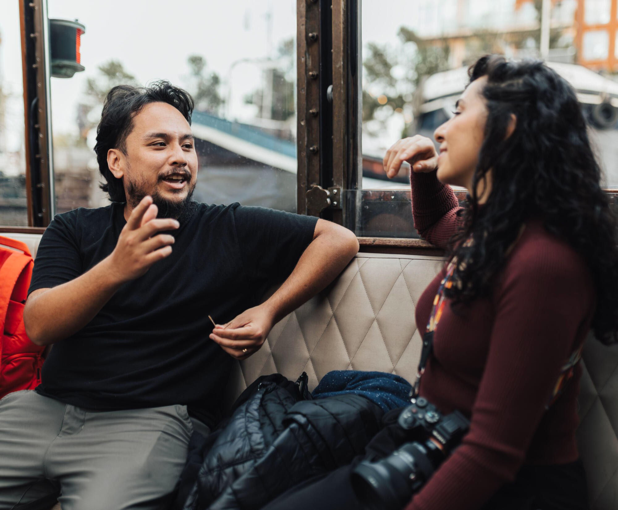 Two people conversing in a public setting